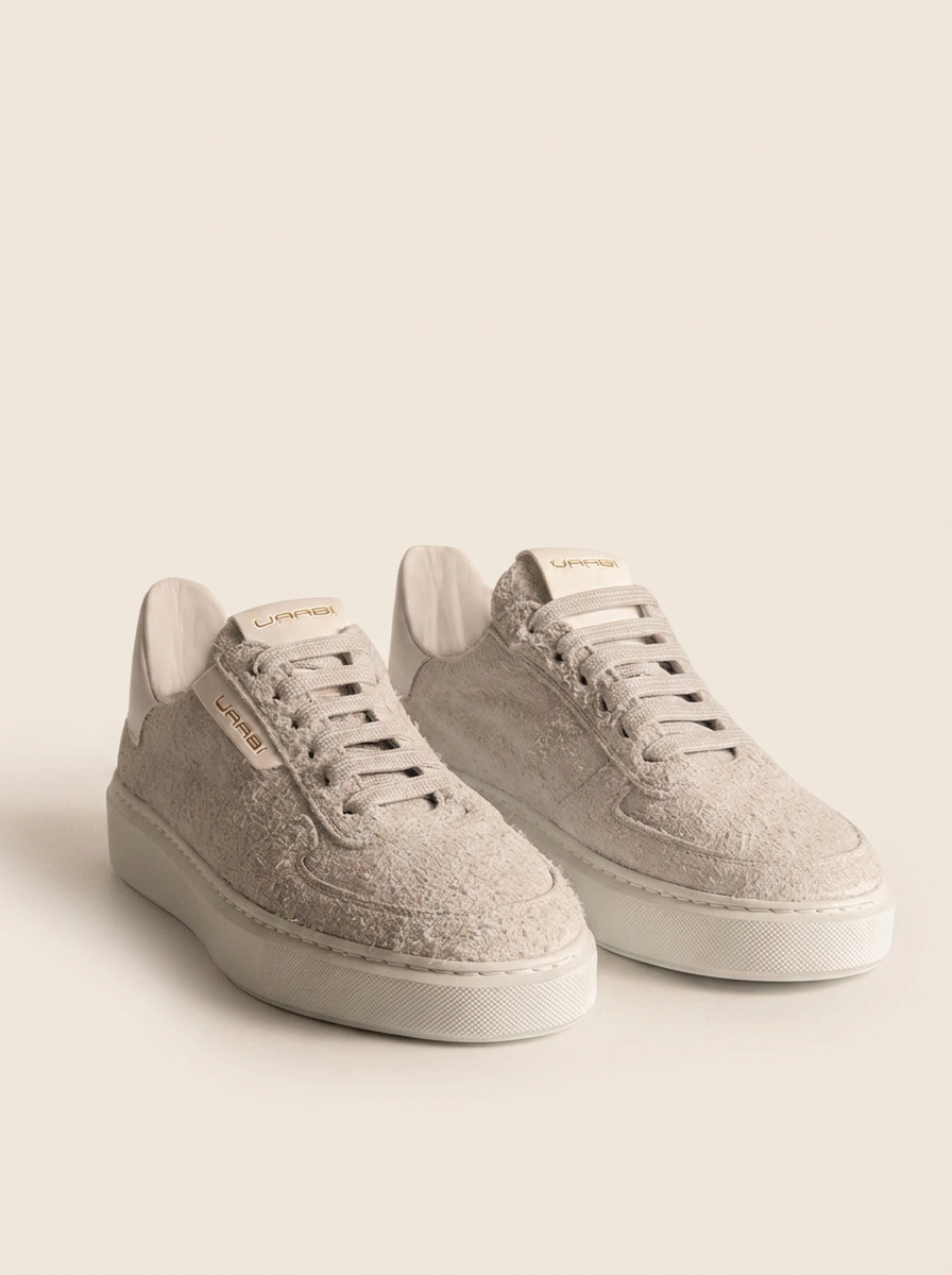 Sneaker EERSTE W21 en piel vuelta blanco roto, vista frontolateral